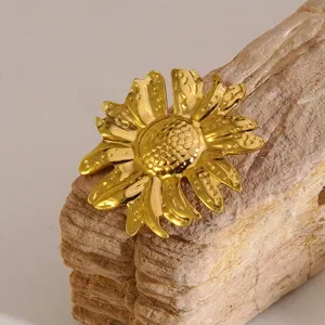 Gold flower brooch detail view, premium metallic floral pin for elegant daily wear outfits.