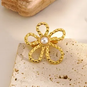 Elegant gold flower brooch with central faux pearl, premium stainless steel accessory main view.