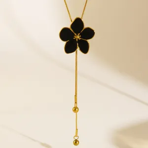 Elegant 18K gold plated black enamel five petal flower lariat necklace detail shot.