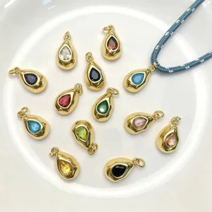 Detailed view of colorful teardrop gemstone metal pendants and braided rope necklace accessories.
