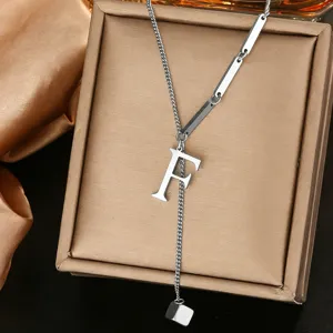 Detail view of the silver stainless steel letter F pendant necklace with elegant chain design.