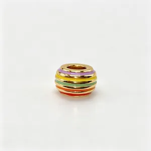 Detailed close-up view of a gold-plated colorful striped enamel bead for DIY charm jewelry.