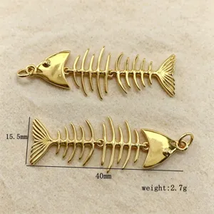 Gold articulated fish bone pendant DIY jewelry finding, approx 40mm length, detailed design.