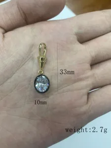 Pendente placcato in rame con pietra di cristallo ovale, dimensioni 33x10mm, peso 2.7g per bigiotteria.