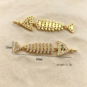 Detail view of gold-plated fish skeleton pendant, paved cubic zirconia, 40mm length DIY charm.