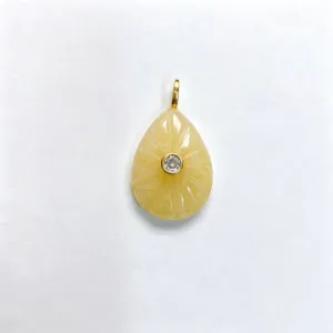 Exquisite teardrop yellow crystal pendant detail, featuring carved stone and center zircon.