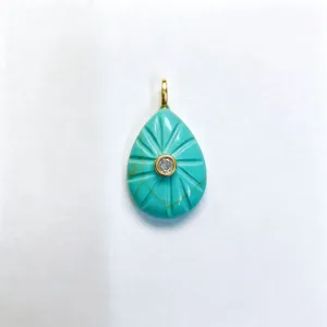 Teardrop turquoise pendant with radial carved grooves and center stone for DIY necklace charm.