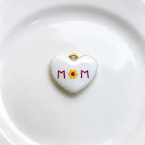 Heart pendant detail with enamel flower and MOM letter design, exquisite necklace accessory.