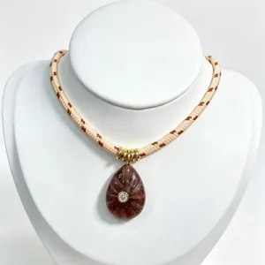 Natural crystal teardrop pendant necklace with woven cord and zircon stone detail.