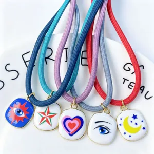 Colorful cord necklace set with enamel pendants featuring star, heart, and moon designs.