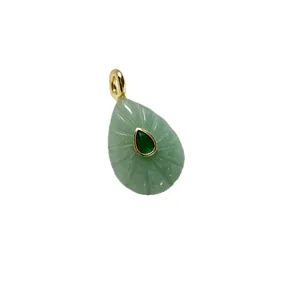 Natural green aventurine teardrop pendant with gold bail and central zircon stone.