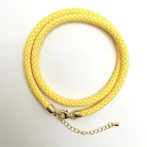 Yellow braided rope necklace detail, gold metal clasp, DIY handmade cord jewelry accessory