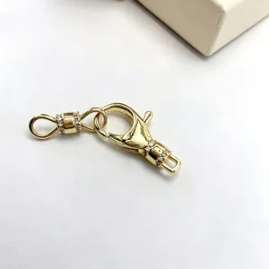 Close-up detail of gold-plated micro-pave zirconia clasp connector for DIY jewelry making.