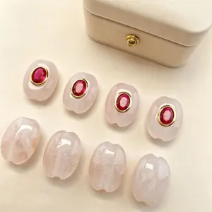 Natural stone spacer beads with red zircon and gold plated brass for DIY jewelry making.