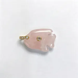 Natural pink crystal tropical fish pendant with sparkling zirconia inlay and elegant gold finish.