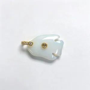 Natural stone tropical fish crystal pendant detail close-up showing exquisite zircon gold inlay.