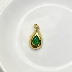 Gold teardrop pendant necklace with vibrant green gemstone elegant fashion jewelry accessory