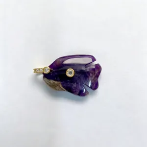 Natural amethyst crystal carved fish pendant detail showing gold and zircon setting close up.