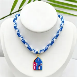 Detailed view of the colorful house enamel pendant necklace with blue and white braided rope.