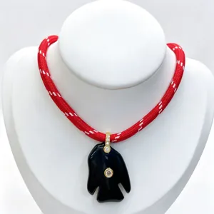 Natural stone tropical fish pendant necklace with diamond zircon inlay and red woven cord.