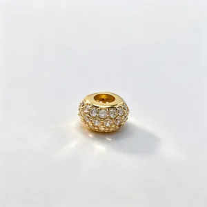 Close-up detail of gold plated pavé cz large hole bead for DIY jewelry and bracelet making.