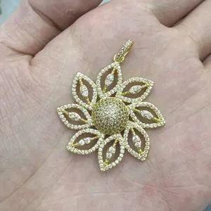 Golden flower full diamond pendant exquisite detail shot, fashion niche jewelry accessory.
