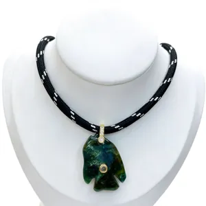 Natural stone tropical fish pendant necklace with diamond zircon inlay and black rope.