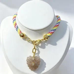 Natural stone crystal heart carved pendant necklace with colorful braided cord and zircon accents.