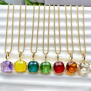 Detailed close-up view of square colorful zircon 18k gold plated pendant necklaces.
