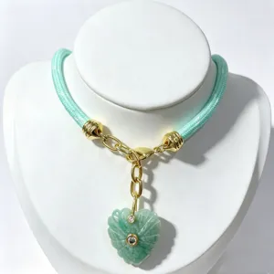 Green rope necklace with carved heart crystal pendant and gold hardware for daily jewelry styling.