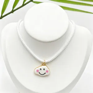 Cute smiling cloud pendant necklace with white cord, sweet jewelry accessory for daily wear.