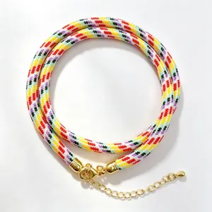 Vibrant multi-color braided rope cord necklace featuring polished gold lobster clasp.
