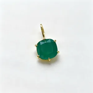 Close-up detail view of a square green gemstone pendant with polished gold-plated copper setting.
