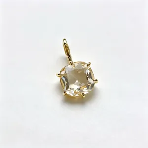 Detail view of a square champagne cubic zirconia pendant with 18k gold plated copper.