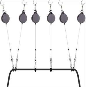 Detailed view of VR cable management system, retractable pulley hooks for headset setup.