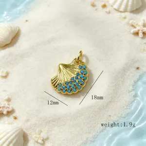 Magnifique pendentif coquillage doré avec perles turquoise pour création de bijoux marins.