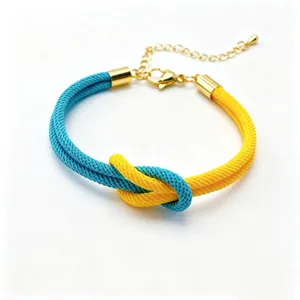 Blue and yellow braided rope bracelet with golden metal details and adjustable chain.