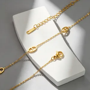 Detailed view of 18k gold titanium steel anchor chain necklace with stylish pig nose links.