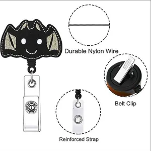 Detail view of Halloween bat retractable badge reel with durable nylon wire and belt clip.