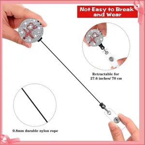 Retractable nurse badge reel with rhinestone heart stethoscope design and durable nylon rope.