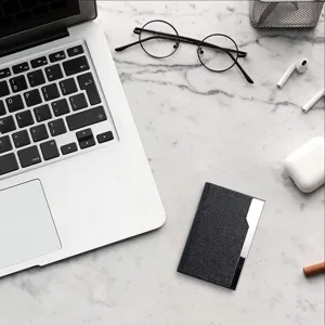 Stainless steel PU leather business card holder sleek modern office desk accessory gift.