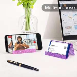 Detail view of glitter business card holder and phone stand desk organizer for office gift.