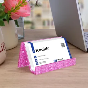 Pink glitter acrylic business card holder for office desk and professional display use.