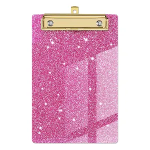 Support de bloc-notes acrylique rose pailletee avec clip dore pour le bureau moderne.
