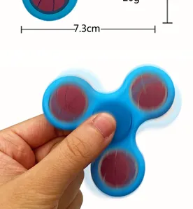 Blue tri-spinner fidget toy with basketball pattern, stress relief hand toy detail view.