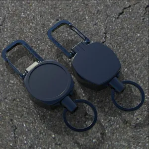Retractable keychain carabiner detail shot, heavy-duty metal wire cord reel for outdoor use.