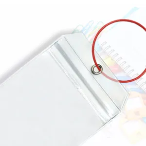 Clear plastic luggage tag detail view, waterproof vertical badge holder with red cord loop.