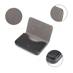 Detail view of black PU leather magnetic business card holder with fine stitching.