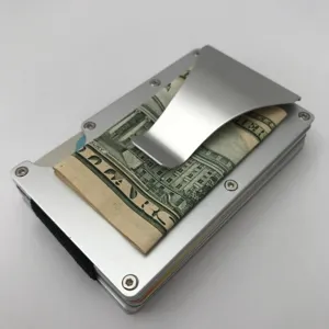 Detail view of silver aluminum minimalist card wallet with metal money clip and elastic band.