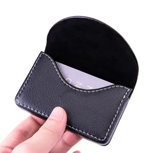 Black PU leather business card holder with magnetic closure and elegant half-moon flap design.